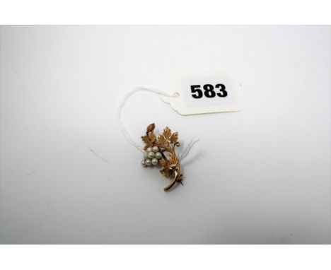 A seed pearl and 9ct gold foliate brooch.