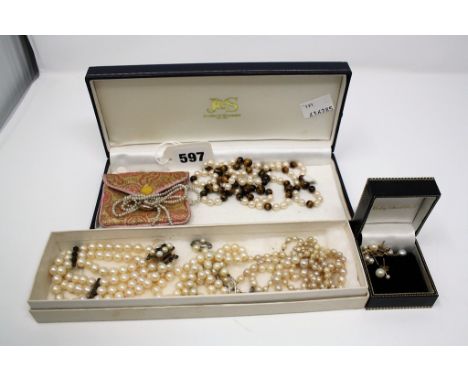 Four cultured pearl necklaces, a cultured pearl & garnet three row bracelet, a seed pearl necklace and three pairs of culture