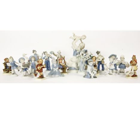 A collection of Continental porcelain figures, to include musicians, a mother and baby, Goebel children, and a Lladro goose