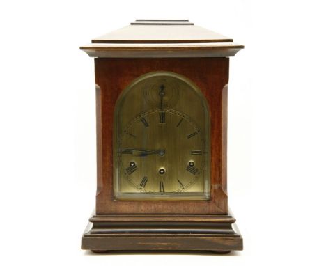 A mantel clock, with an arched brass dial, with strike/silent, 41cm high