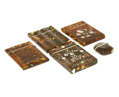 Four tortoiseshell card cases, 19th century, one of serpentine shape with white metal stringing, one with mother of pearl inl