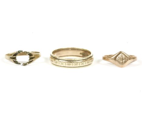 A 9ct gold band ring with diamond cut engraved decoration, a 9ct rose gold signet ring, and a 9ct gold ring, damaged stone de