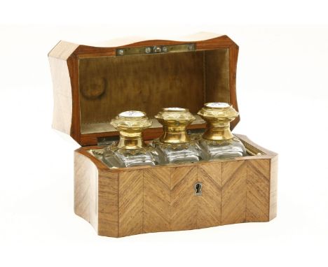 A late 19th century French parquetry inlaid Kingwood scent bottle holder, the shaped top inlaid with brass and mother of pear