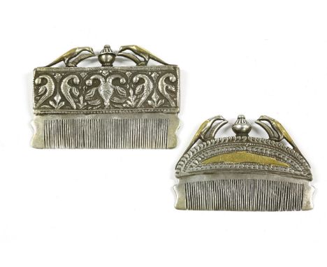 A Mughal style white metal and gilded beard comb, the rectangular handle decorated in relief with stylised birds and foliate 