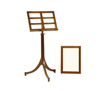 An Edwardian mahogany music stand, the adjustable lectern on fluted column and tripod base, height 105 - 140 cm, together wit