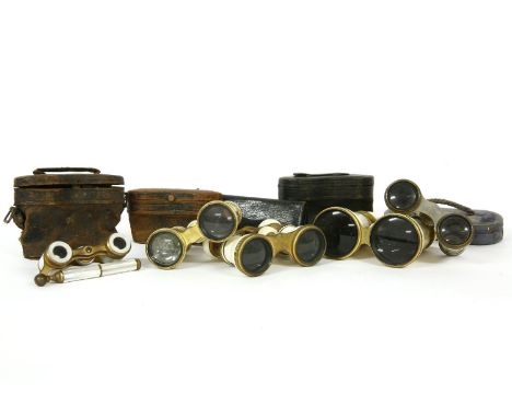 Two pairs of late Victorian ivory mounted opera glasses, one stamped 'Callaghan, 23 New Bond St.......London', with engraved 