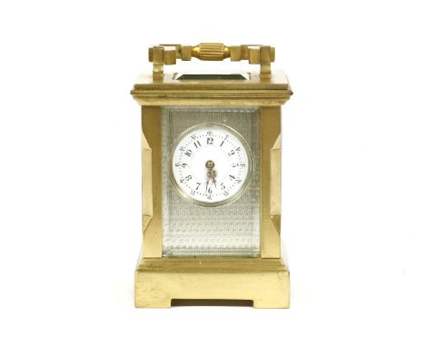 A gilt brass cased miniature bevelled glass carriage clock, a white enamel dial with Arabic numerals, seconds track to a silv