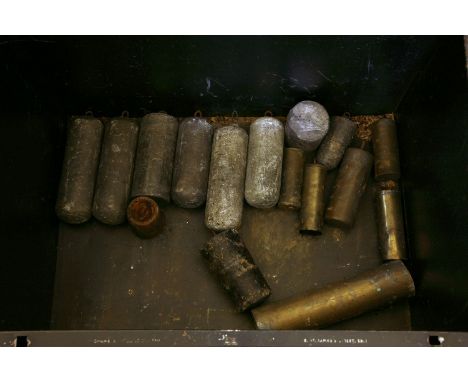 A tin trunk of longcase clock weights, mainly lead