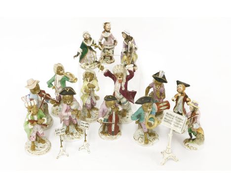 A Meissen style monkey band, 19th century, including drummer boy, bagpipe player, French horn, trumpet, bassoon, pipe, fiddle