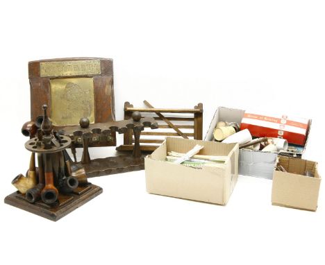 Smoking items, collection of pipes on racks, including Briar and Meerschaum, also smoking accessories, cheroot holders, clean