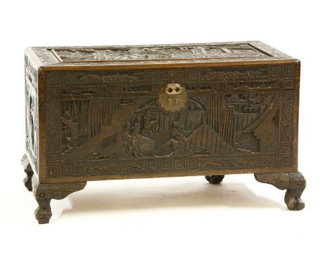 A Chinese carved camphorwood trunk, early 20th century, 90cm wide