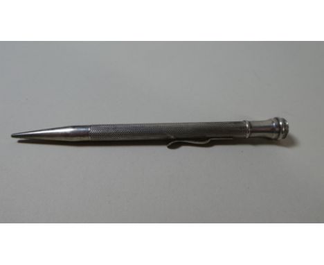 A Silver Propelling Pencil with Engine Turned Decoration