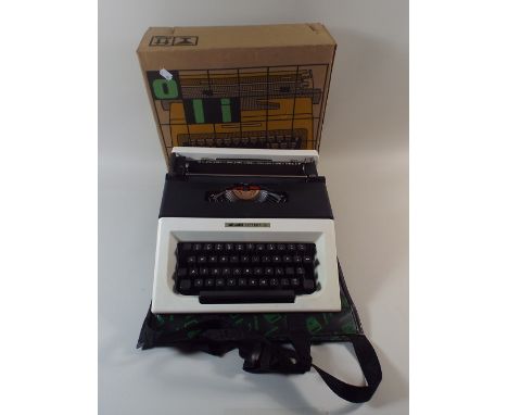 An Olivetti Lettera 15 Manual Typewriter with Dust Cover and Box