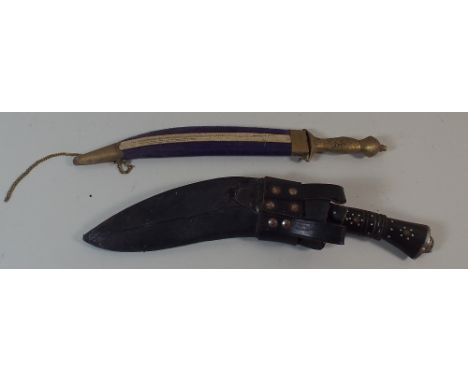 A Kukri Knife in Leather Scabbard in Leather with Daggers Together with a Brass Handled Indian Dagger