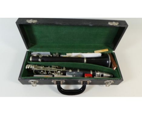 A Cased Rene Duval Clarinet with Spare Reeds and Accessories 