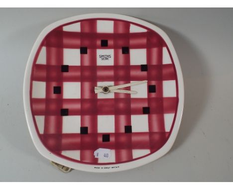 A 1950's Smiths Sectric Ceramic Wall Clock, 24cm high