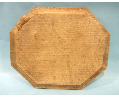 A Robert (Mouseman) Thompson of Kilburn workshop oak bread board of octagonal shape, carved with mouse trademarks, 30.5cm acr