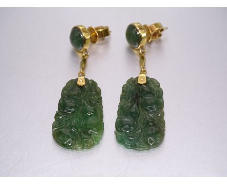 A pair of gold-mounted carved jade pendant earrings, the butterfly backs stamped 14k, 4.7cm long, 7.8g. 
