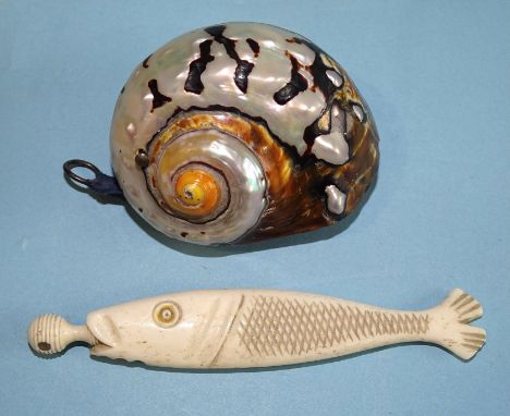 A bone needle case in the form of a fish, the screw top inset a Stanhope 'Souvenir of Plymouth', with six views, 104mm and a 