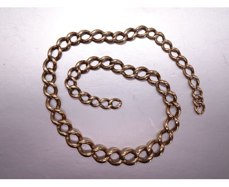 A watch chain of 9ct rose gold graduated curb links, (no T-bar or shackle), some links indistinctly-marked '9c', 35cm, 33.8g.