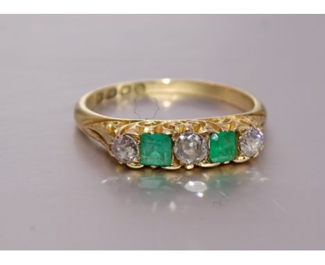 A five-stone emerald and diamond ring claw-set two square-cut emeralds and three brilliant-cut diamonds, in 18ct gold mount, 