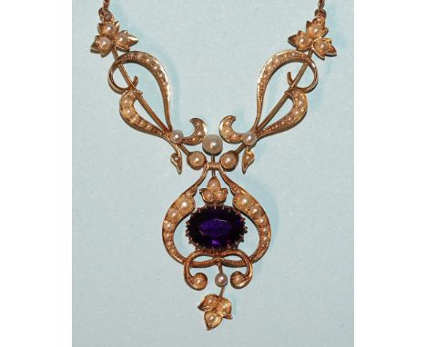 A late-Victorian 15ct gold necklace set oval amethyst of intense colour, within openwork scrolling frame set seed pearls, on 