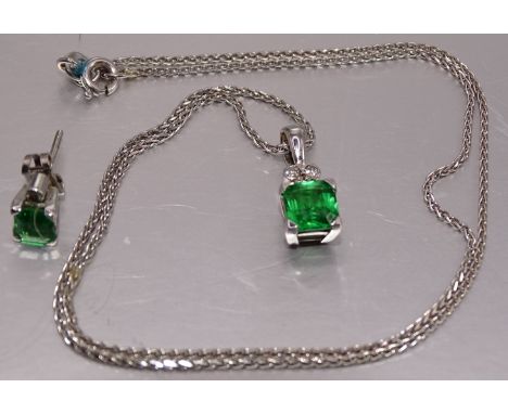 A tsavorite and diamond pendant set a square-cut tsavorite of approximately 1.2cts, below a cluster of three brilliant-cut di