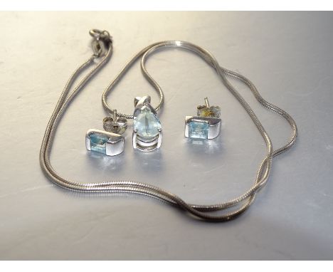 An aquamarine and diamond 9k white gold pendant on silver neck chain and a pair of 9ct gold aquamarine ear studs, gold items 