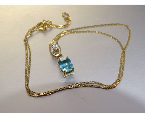A 9ct yellow gold pendant set oval blue zircon and synthetic white stones, on 9ct gold neck chain, 45cm long, 2.8g. 