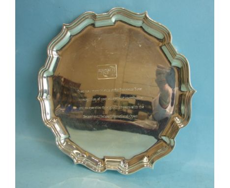 A modern Chippendale-style silver salver on three tab feet by Asprey, 22cm diameter, ___12oz, engraved with inscription. 