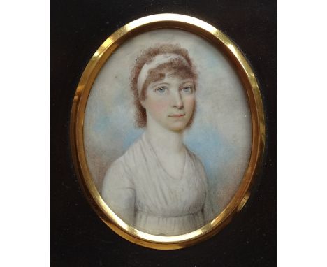 An early-19th century oval portrait miniature of a young woman wearing a white dress and head band, half-length, 72 x 58mm, i