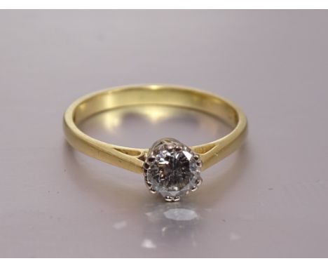 A solitaire diamond ring claw-set a brilliant-cut diamond of 0.5cts, in 18ct gold mount, size O½, 2.8g. 