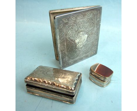 An Asian white metal case decorated with flowers and leaves, 8 x 9cm, a white metal snuff box, 7 x 4cm and an onyx and white 