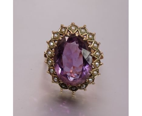 A large amethyst and pearl dress ring with 9ct gold mount, cluster 22 x 17mm, size O, 7.6g. 