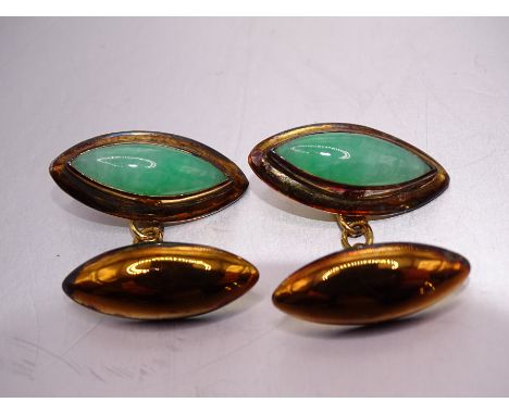 A pair of 14k gold cufflinks of lozenge shape set jade, 22 x 9mm, 8g. 