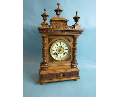 A late-19th/early-20th century walnut case mantel clock of architectural form, with 8-day gong-striking movement, labelled H.
