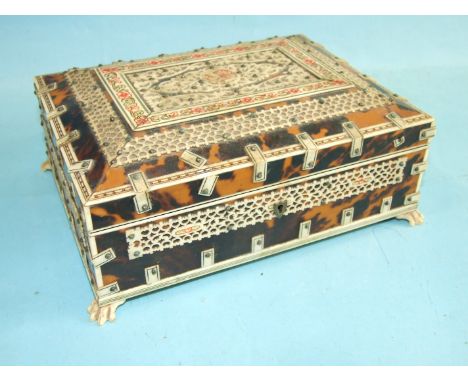 A tortoiseshell-covered rectangular box&nbsp;with applied ivory detail, on carved bone paw feet, 22 x 16cm. 