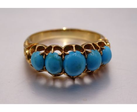 A Victorian gold ring claw-set five graduated turquoise stones, unmarked, (tests as 18ct), size M, 4.9g, in heart-shaped ring