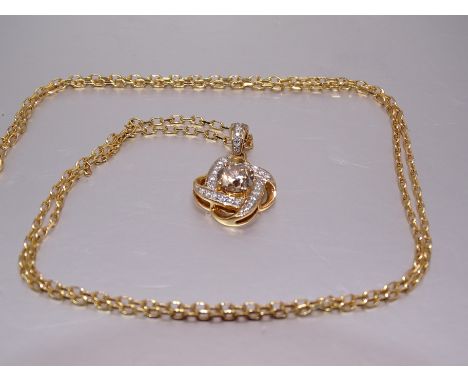 A diamond pendant centrally claw-set a brilliant-cut fancy brown diamond of approximately 1ct, in 18ct quatrefoil mount set t