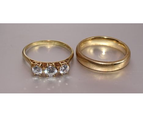 A 9ct gold wedding band, size M, 3.8g and a 9ct gold ring set three C-Z stones, size N, 1.6g, (2). 