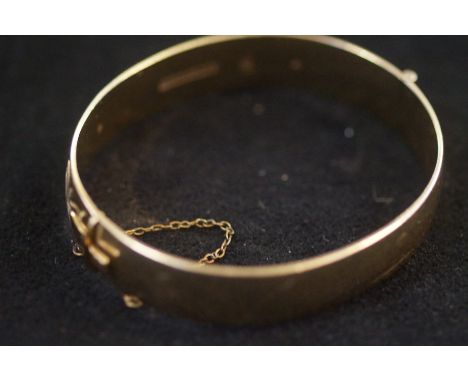 9ct Gold bangle with metal core Weight 35.7g