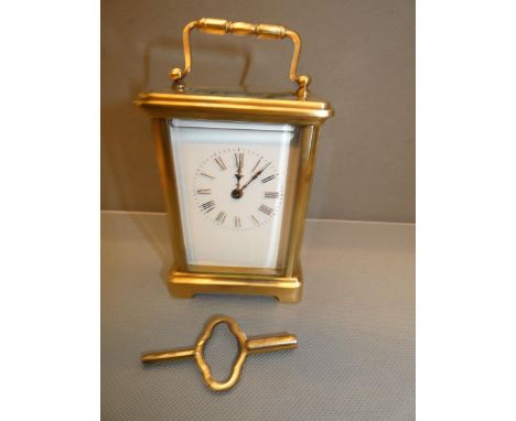 Good quality brass carriage clock currently ticking with key 