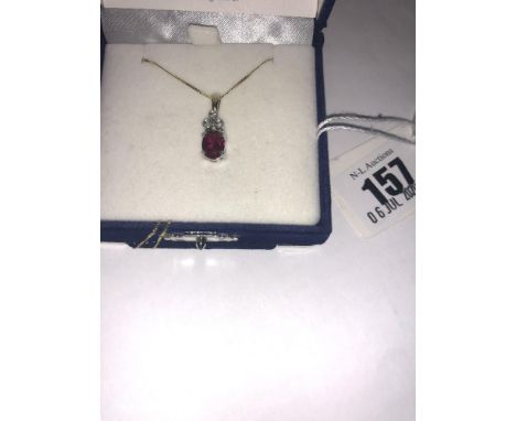 A 9ct gold, diamond and ruby pendant on chain