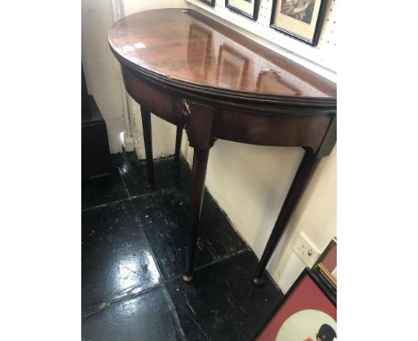 An inlaid mahogany demi lune card table