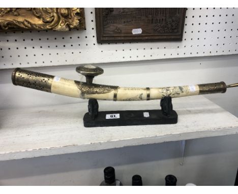 An early oriental decorative opium pipe on stand