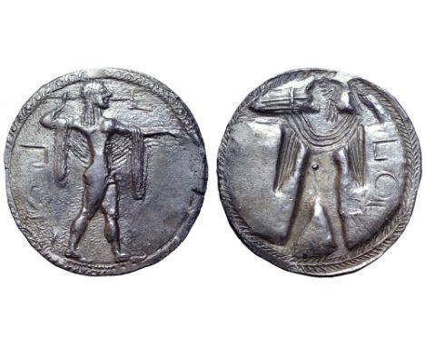 Lucania, Poseidonia AR Stater. Circa 530-500 BC. Poseidon, diademed and wearing chlamys over shoulders, advancing right, wiel