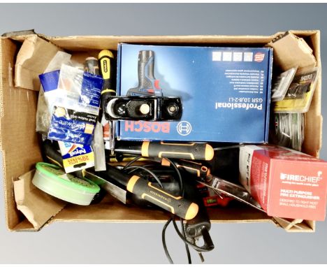 A box containing assorted power and hand tools including a boxed Bosch professional 10.8v drill, fire extinguisher, a Magnuss