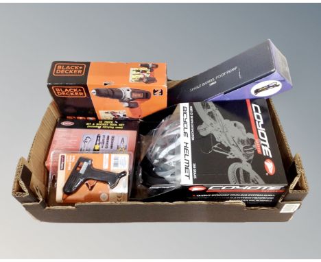 A box containing Coyote Sports cycle helmet, Black and Decker 18v electric drill, single barrel foot pump, a 43 piece bit and