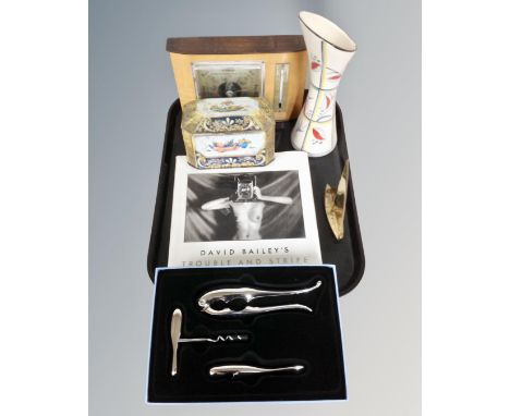 A tray containing a Wedgwood bottle opening and nutcracker set, boxed, a vintage tin, David Baileys Trouble and Strife book, 