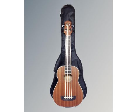 A Countryman model UB electric bass ukulele in carry bag 